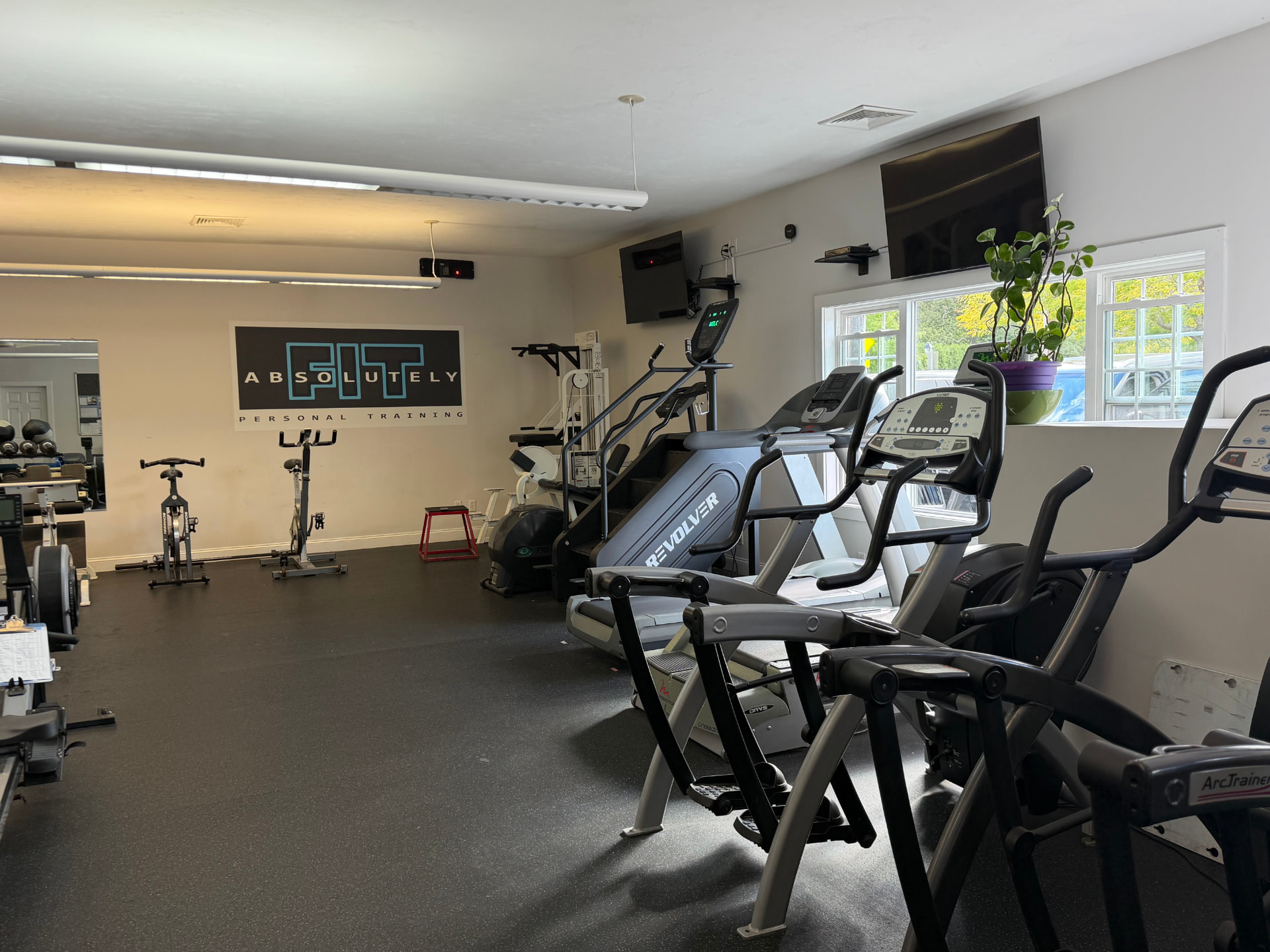 Cardio equipment inside the Absolutely Fit studio