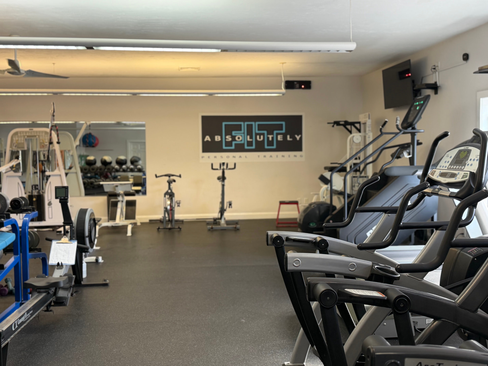 Training floor and cardio equipment at Absolutely Fit